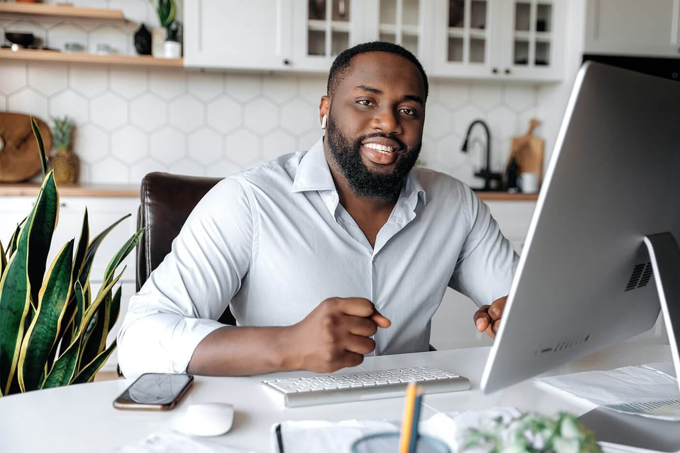 black real estate agent checking email